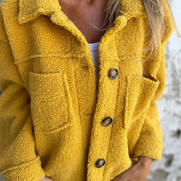 Women's elegant lapel jacket. Short, button-closure design for trendy fall and light winter outerwear.