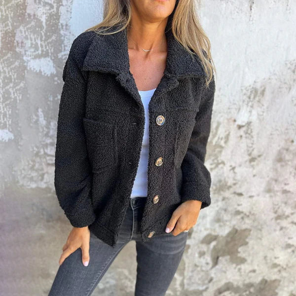 Sophisticated women's short jacket with a stylish lapel collar & button closure. Perfect fall outerwear.