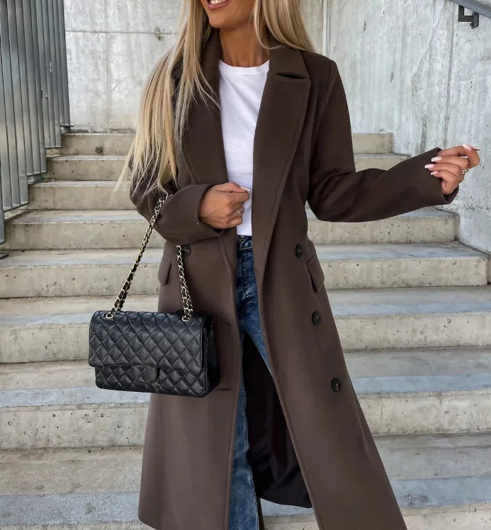 Sophisticated women's belted trench coat featuring a tailored, structured fit. Perfect for professional style.