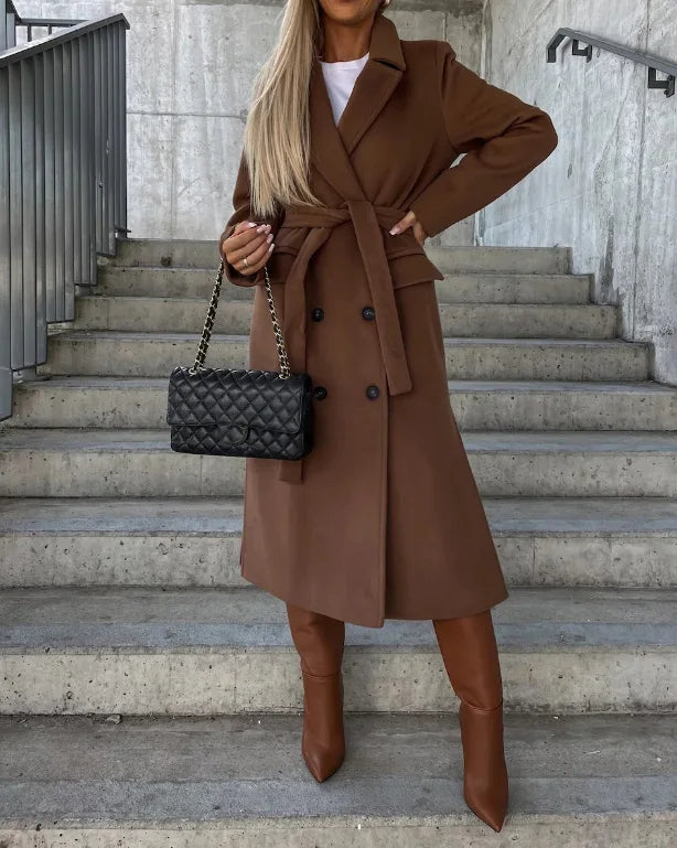 Professional women's long trench coat. A structured, tailored fit makes it ideal for chic office wear & fall.