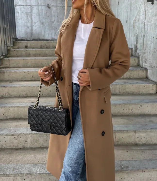 Stylish women's long belted trench coat. Structured & tailored fit offers chic professional outerwear for any season.