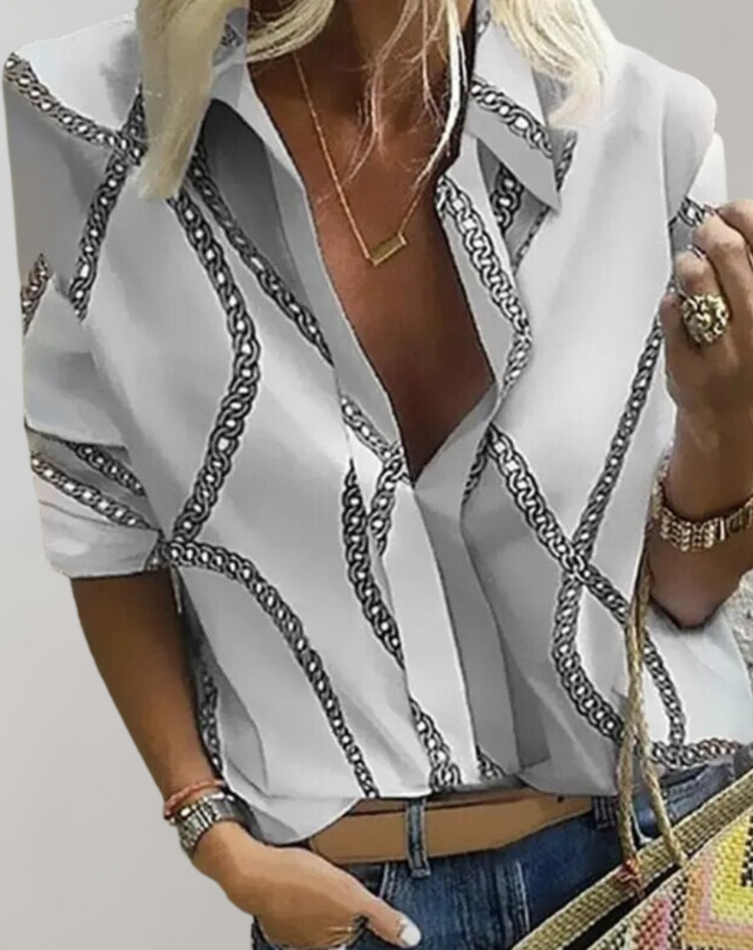 Tailored fit women's long sleeve blouse, adorned with an elegant chain print. Great for office or casual chic.