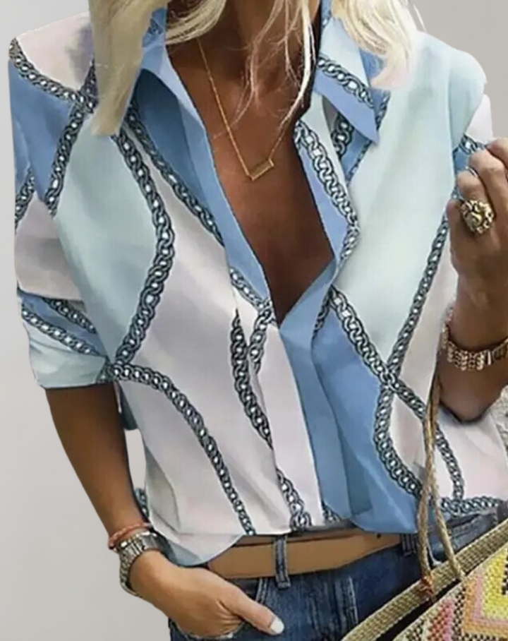 Chic patterned women's long sleeve blouse with a striking chain print. A fashionable statement top.