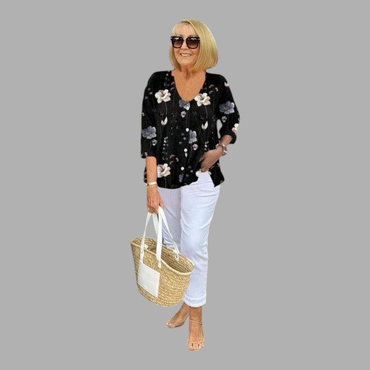 Stylish women's floral print blouse with long sleeves, a feminine & elegant top perfect for spring and summer office wear.