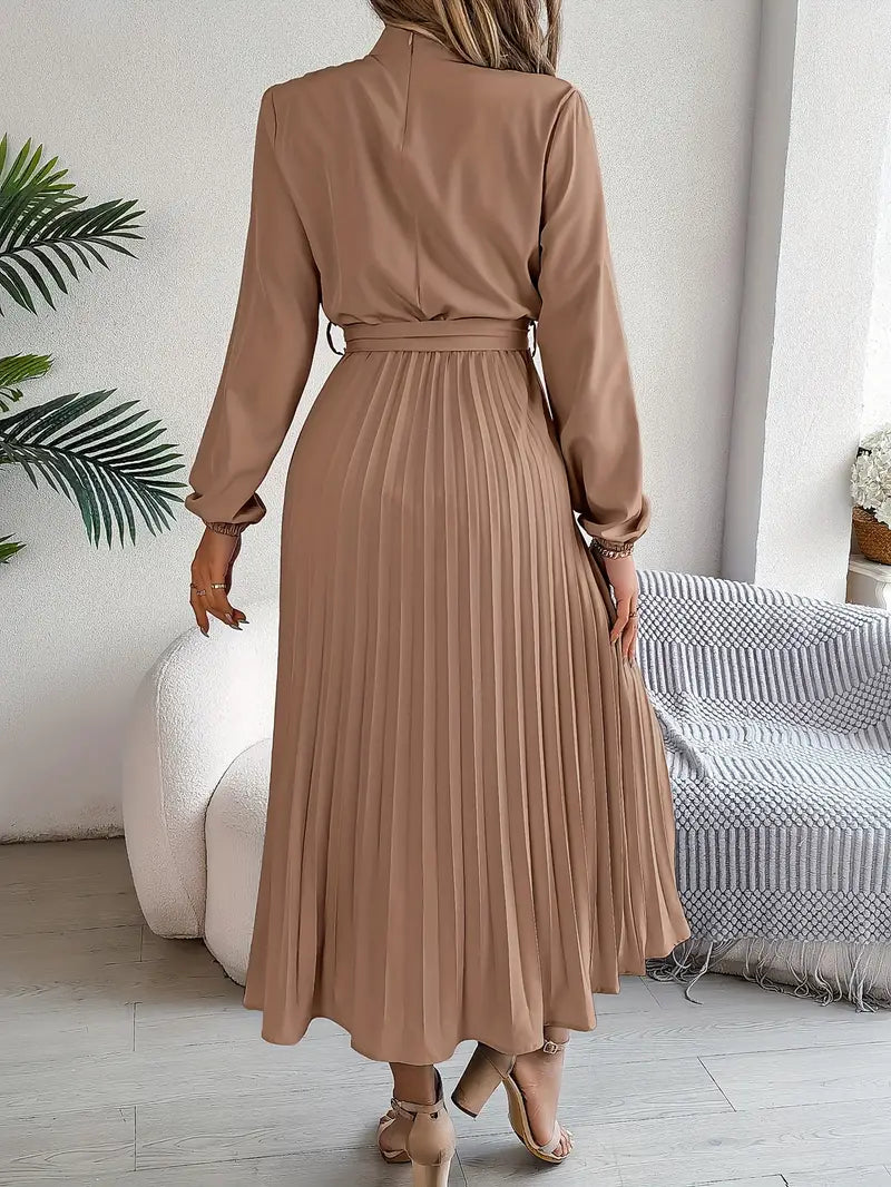Flowing women's belted pleated midi dress with long sleeves, offering an elegant & comfortable fit.