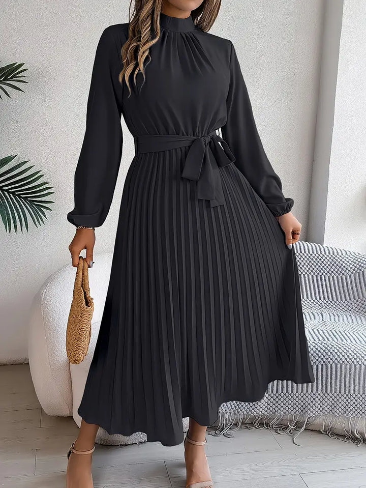 Modern women's elegant long sleeve midi dress, pleated skirt, and stylish belt. Ideal for any occasion.