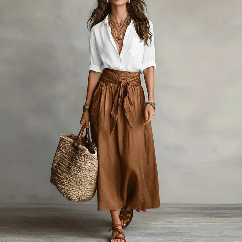 Chic women's two-piece long sleeve skirt suit. Versatile elegant wear for office or casual chic occasions.