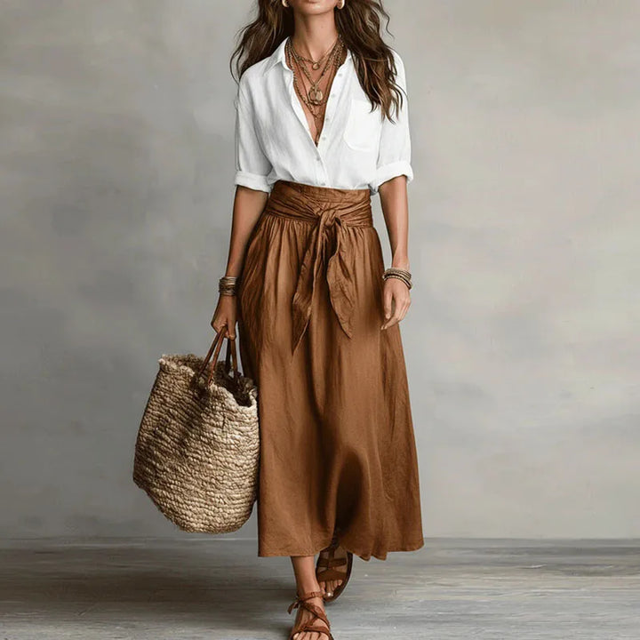 Chic women's two-piece long sleeve skirt suit. Versatile elegant wear for office or casual chic occasions.