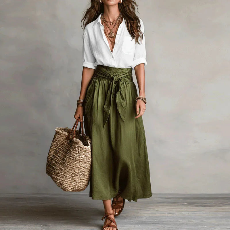 Stylish women's long sleeve co-ord set featuring a button-down top and a sophisticated tie-waist skirt.