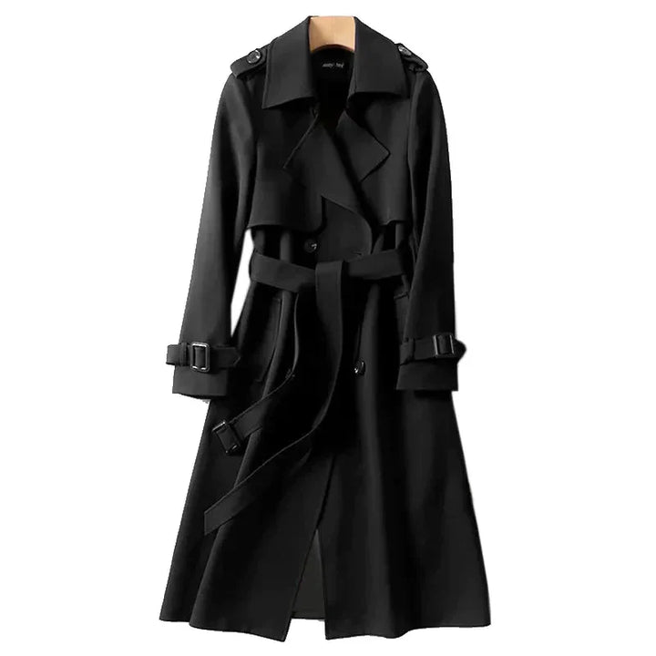Long women's trenchcoat with a flattering tie belt, ideal for autumn outerwear and sophisticated office fashion.