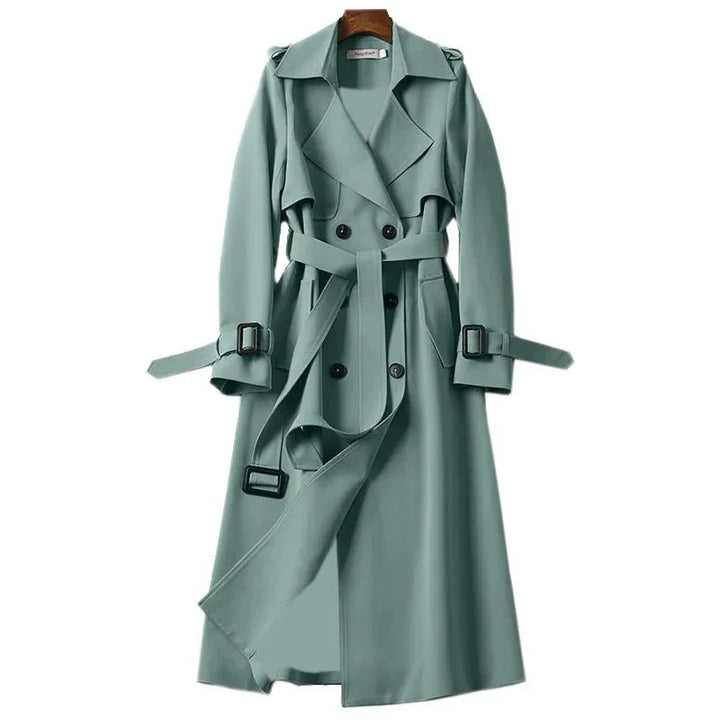 Versatile women's trenchcoat featuring a double-breasted design and tie belt, great for elegant winter style.