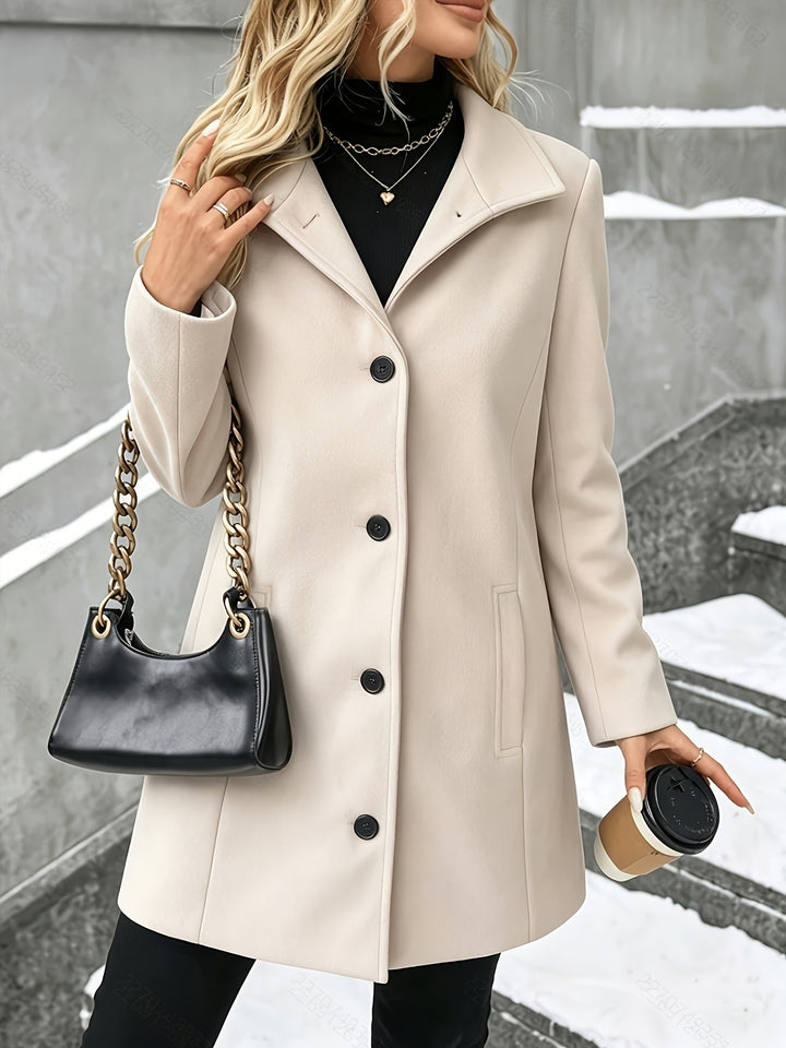 Tailored longline women's coat with an elegant notch collar. Perfect sophisticated outerwear for winter.