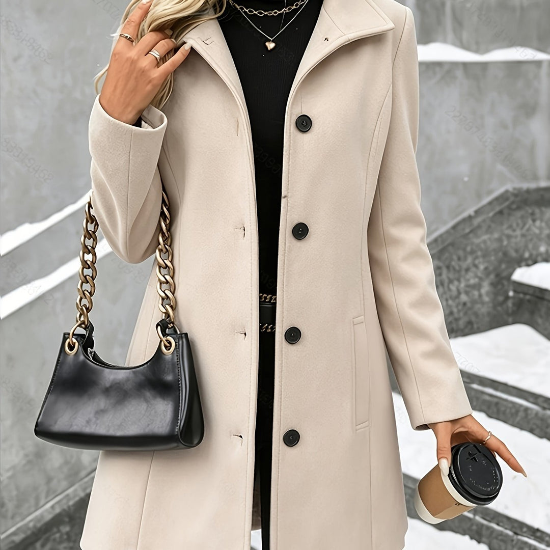 Sophisticated women's longline winter coat. Cozy, tailored, and features an elegant notch collar.