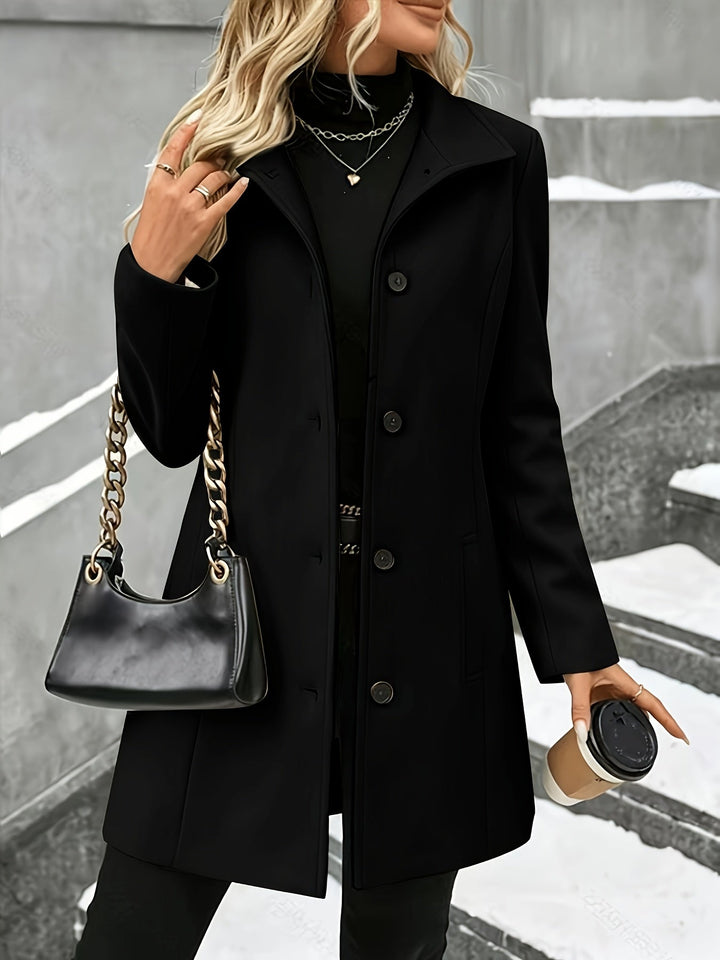Women's tailored longline coat, single-breasted, with a chic notch collar. Perfect elegant winter fashion.