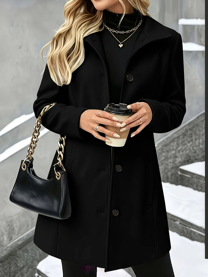 Stylish women's longline winter coat. Features a tailored notch collar and single-breasted design.
