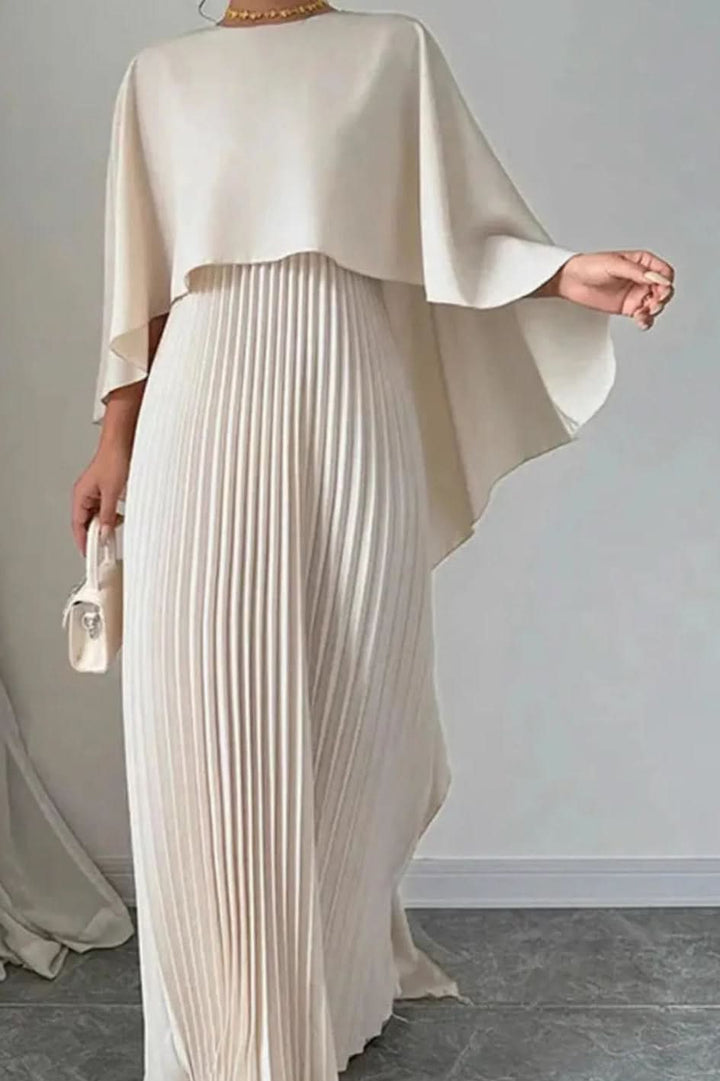 Elegant women's luxe pleated cape maxi dress for special occasions, galas, and formal events. Perfect wedding guest gown.