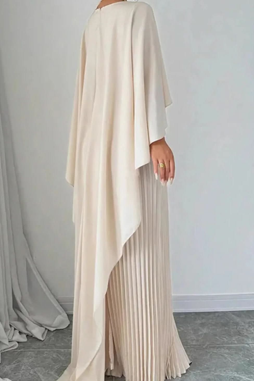 Luxurious women's pleated maxi dress with a flowing cape. Ideal for evening, formal parties, and special events.