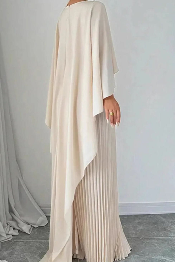 Luxurious women's pleated maxi dress with a flowing cape. Ideal for evening, formal parties, and special events.
