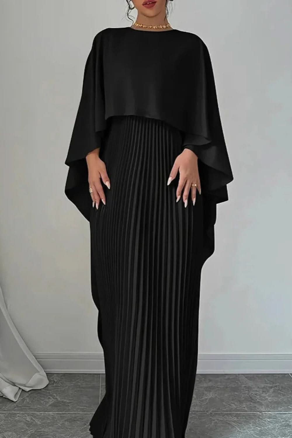 Gorgeous women's formal pleated maxi dress featuring a chic cape. An elegant long gown for galas & special occasions.