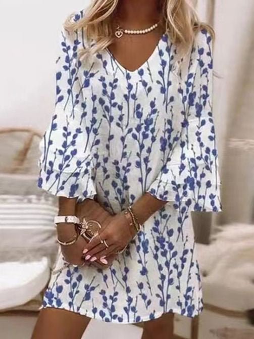 Fashionable women's mini dress, showcasing a unique marble swirl design and elegant flare sleeves for a chic look.