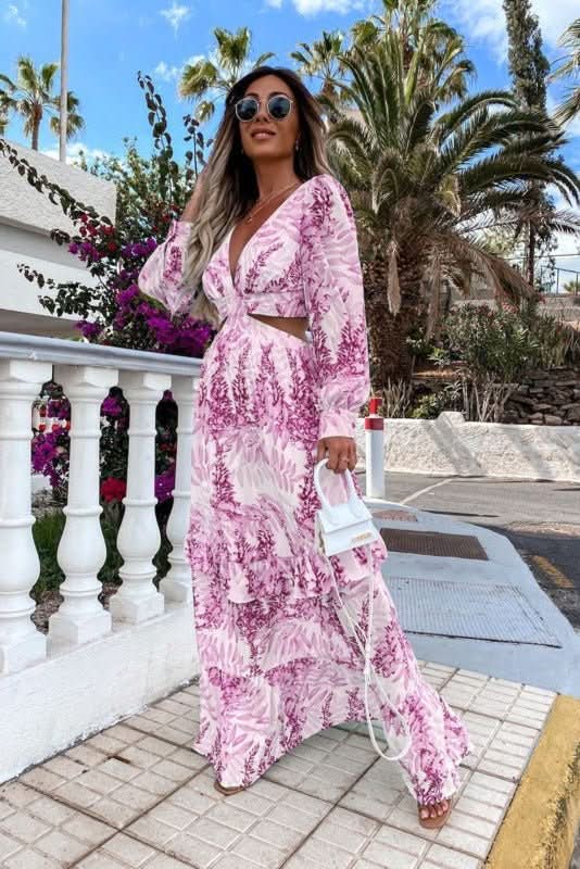 Woman wearing a stylish elegant maxi dress, showcasing flowy design and versatility for everyday wear.