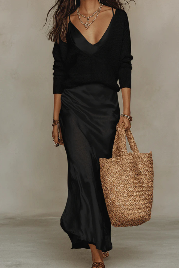 Chic women's fashion set: elegant midi dress and matching sweater for a polished, complete look.