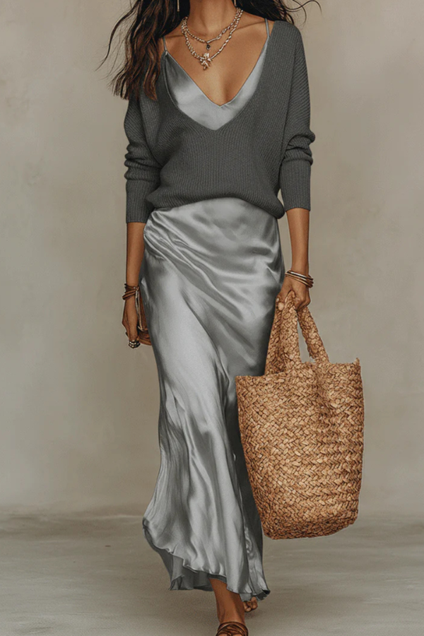 Trendy women's layered outfit: elegant midi dress with a coordinating sweater for effortless fashion.