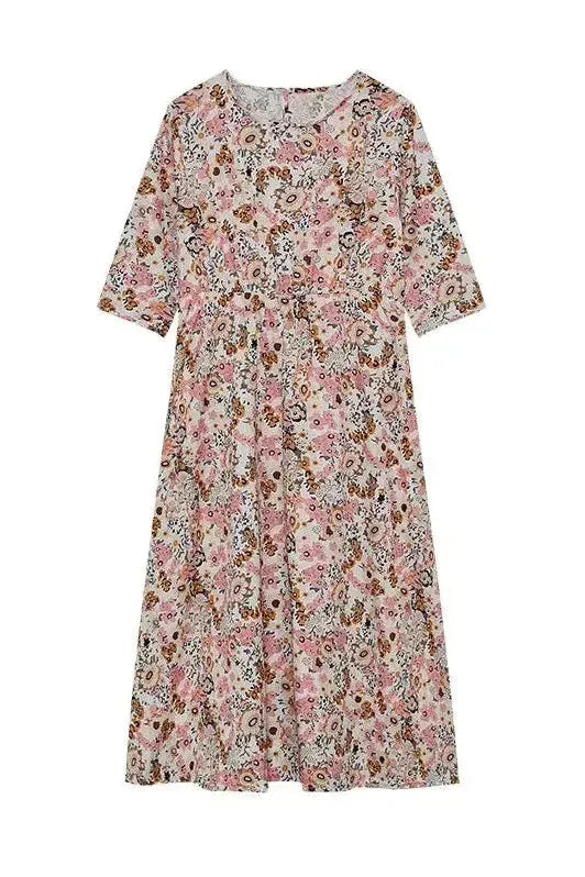 Spring/Summer women's midi dress with elegant buttons, offering timeless style & a comfortable fit.