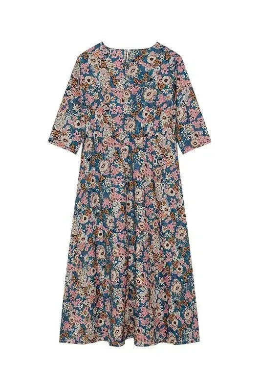 Sophisticated women's midi dress with button detail, a classic style perfect for office or casual chic.