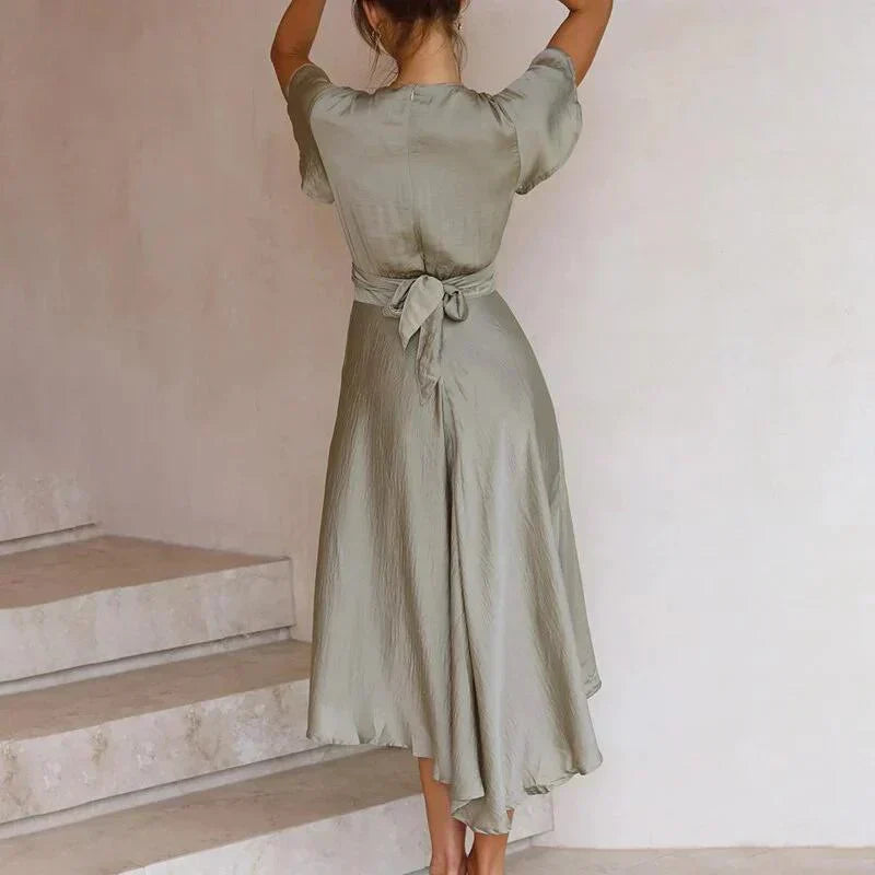 Sophisticated women's V-neck midi dress with intricate tie front, graceful flutter sleeves & elegant silhouette.