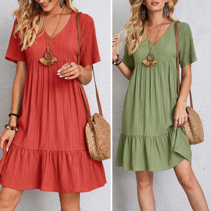 Elegant women's midi dress with flattering belly coverage, perfect for chic daytime or evening events.