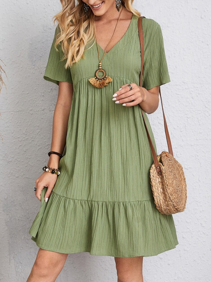 Layered elegant women's midi dress, flattering and comfortable for spring fashion with belly coverage.