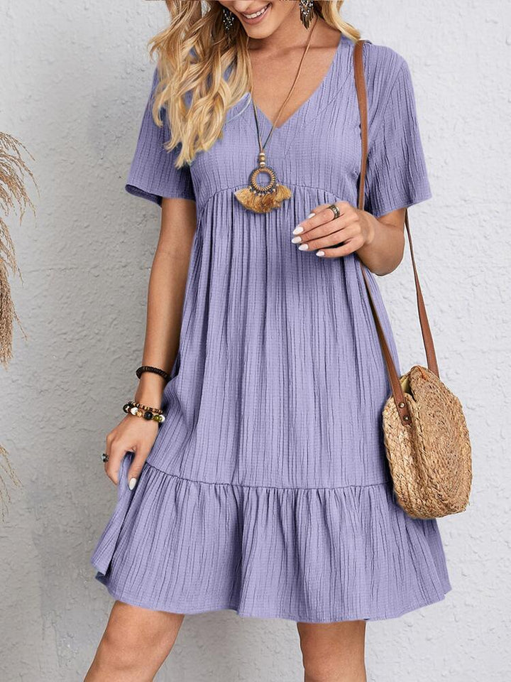 Elegant midi dress for women, offering flattering belly coverage, perfect for daytime outings or evening wear.