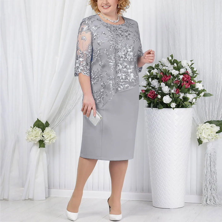 Flattering faux wrap midi dress for women, featuring a ruched waist & elegant short sleeves. Versatile occasion wear.