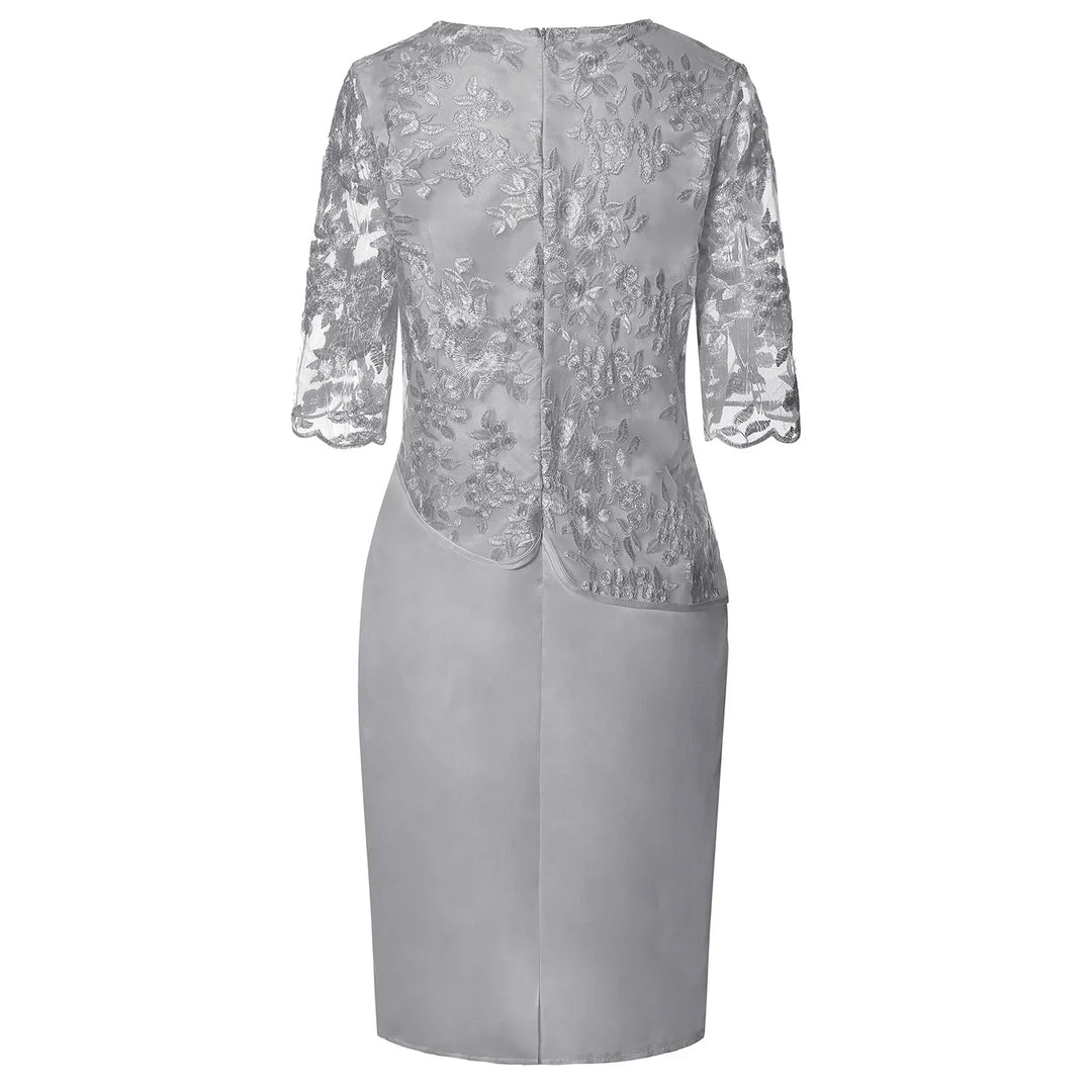 Pink short sleeve midi dress for women. Elegant, flattering design with a ruched waist, perfect for occasion wear.