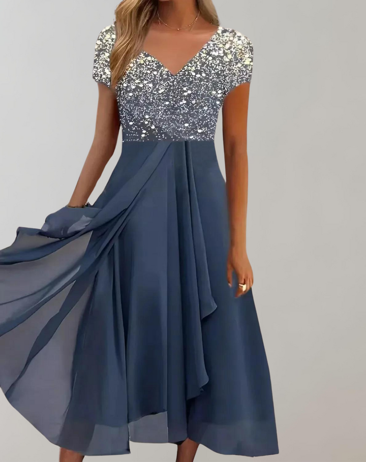 Chic women's midi dress, beautifully embellished with flowers. Elegant short-sleeve V-neck, perfect for any special occasion.