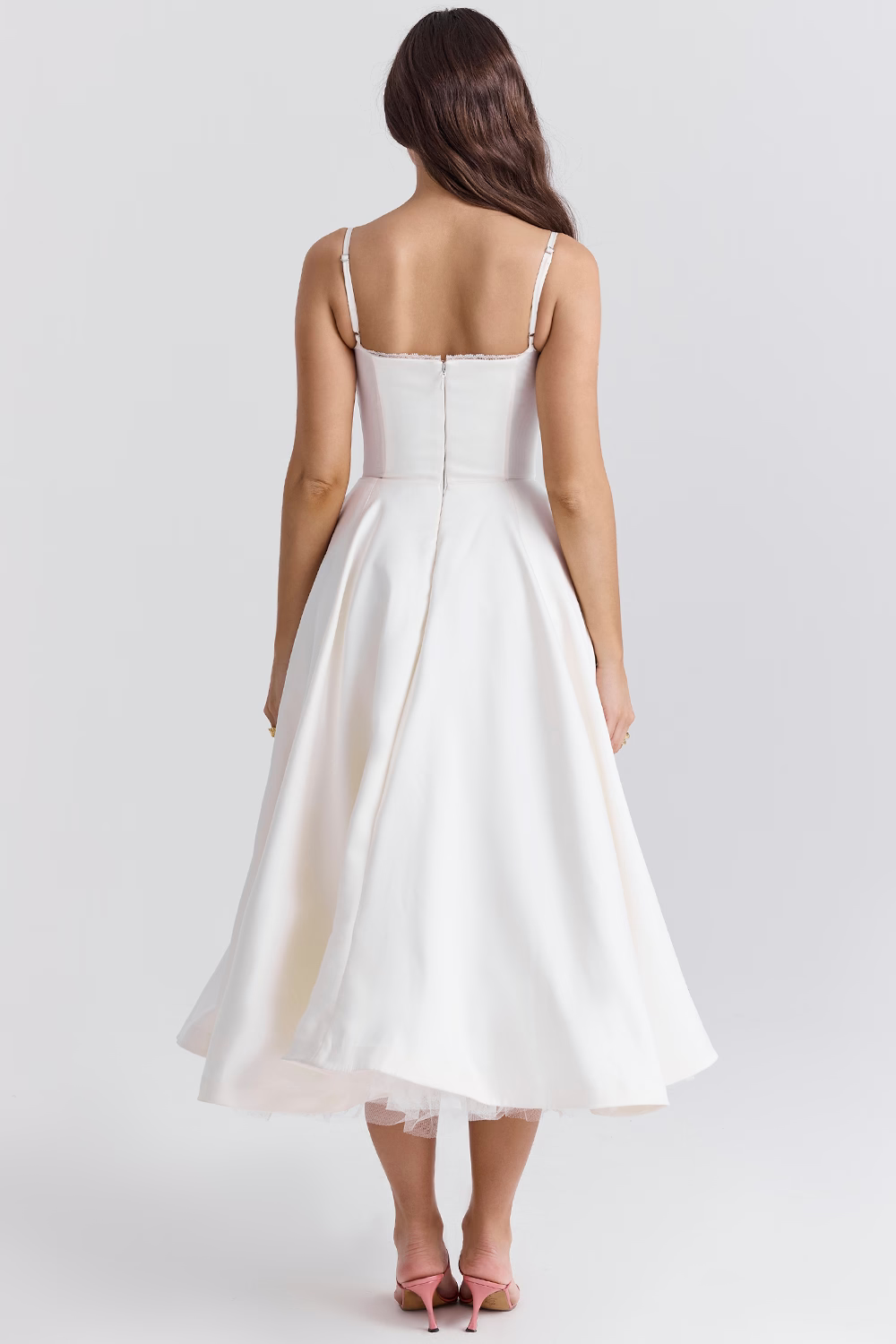 Women's elegant party dress: sleeveless midi length, stunning lace trim, a structured corset design, and essential pockets.