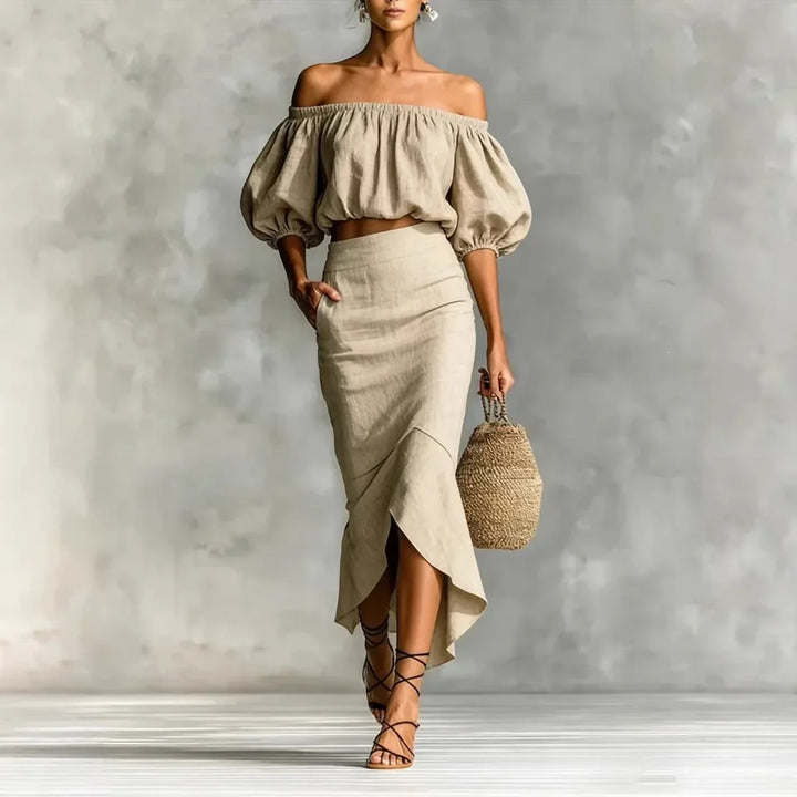 Elegant women's off-shoulder crop top & wrap midi skirt set with chic puff sleeves for summer parties.