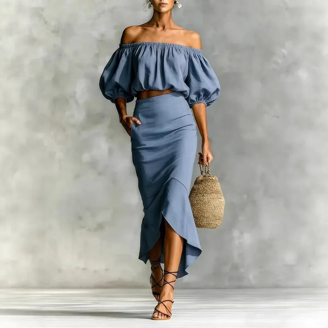 Stylish women's off-shoulder skirt set featuring puff sleeves & a flowy wrap midi skirt, perfect for summer.