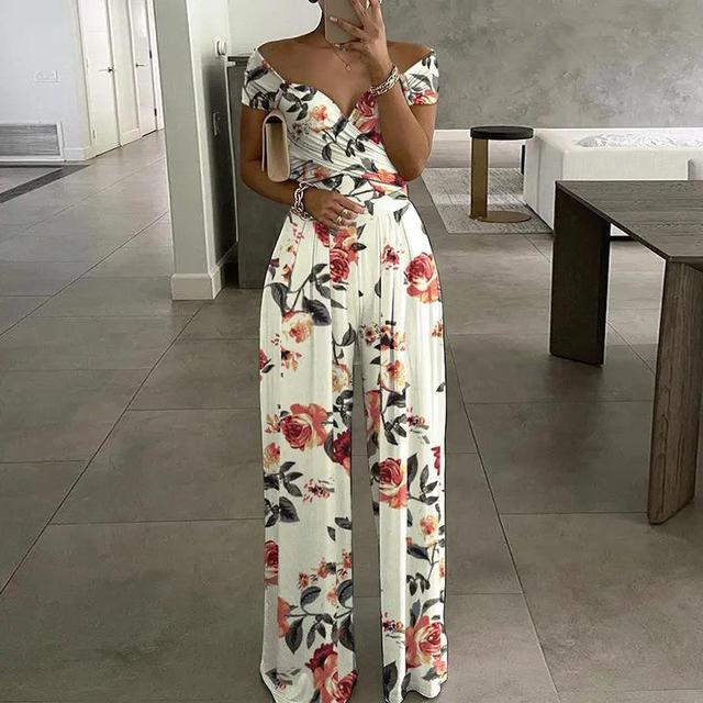 Elegant women's off-shoulder floral wide-leg jumpsuit, perfect for summer vacation wear or casual chic outings.