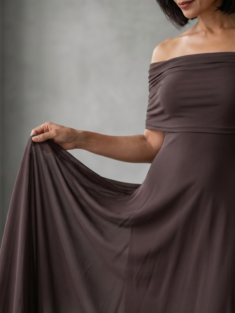 Coral pink off-shoulder midi dress for women, with elegant draped bodice. Perfect wedding guest attire.
