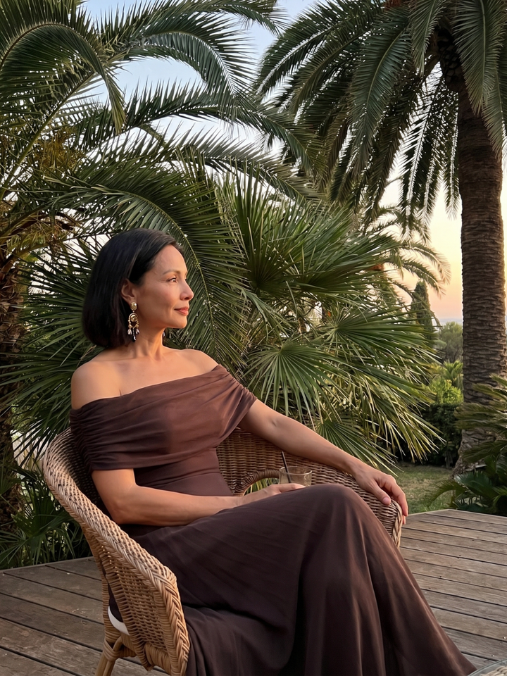 Chic green off-shoulder midi dress for women, featuring a draped bodice. Ideal for elegant events.