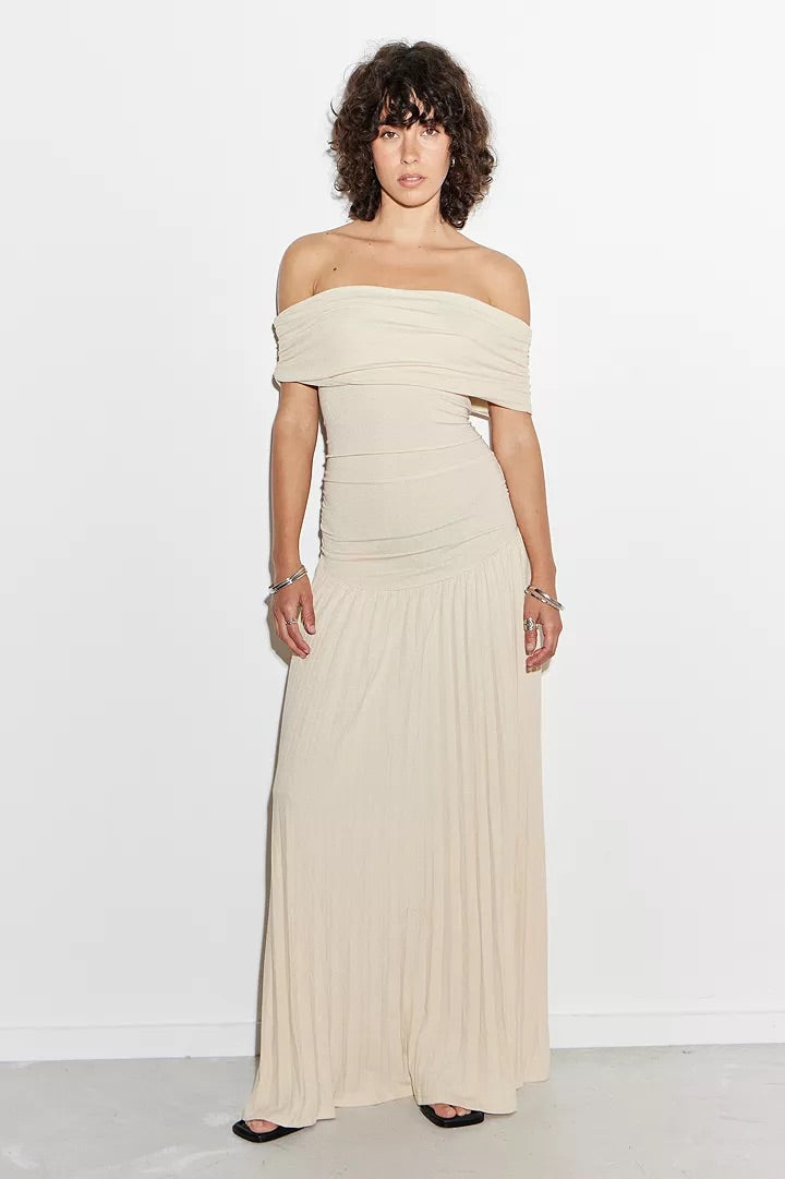 Navy pleated off-shoulder maxi dress for women. A chic and versatile formal gown.