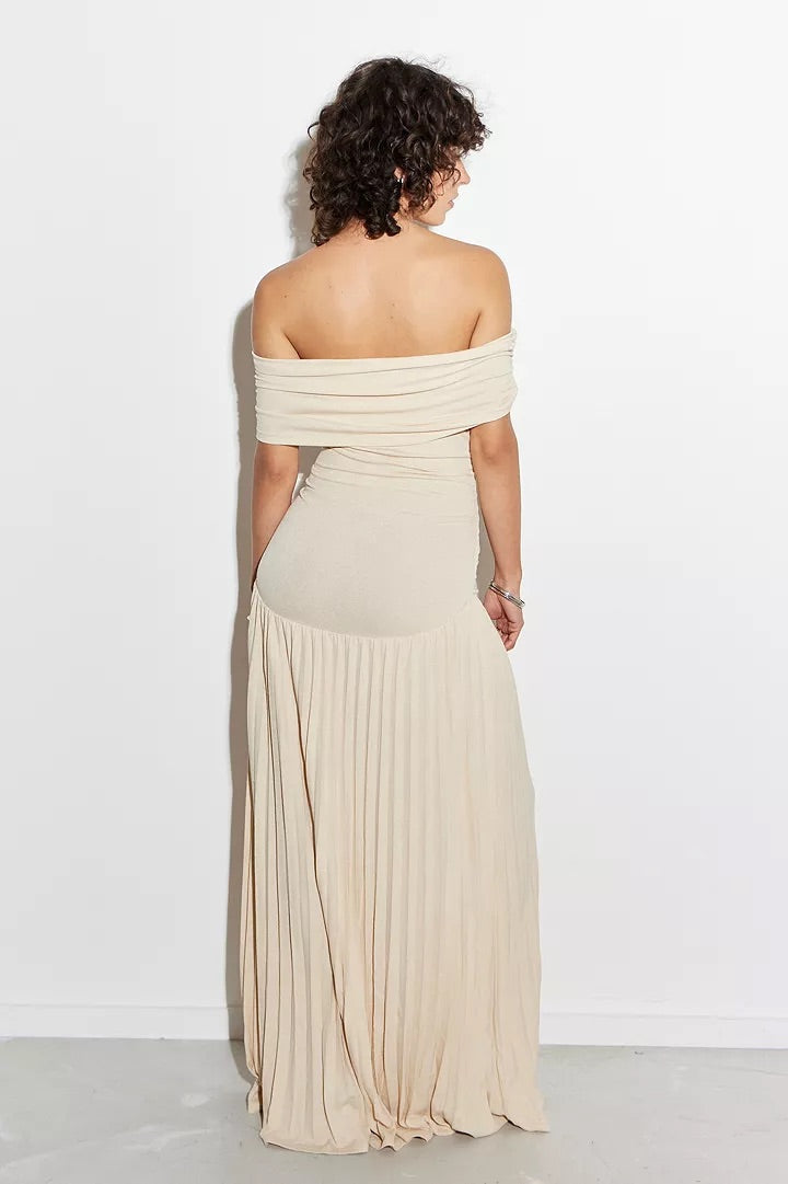 Women's off-shoulder pleated maxi wedding guest dress. Elegant cream color.