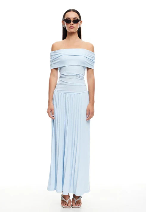 Chic cream off-shoulder pleated maxi dress. Ideal wedding guest dress for special occasions.