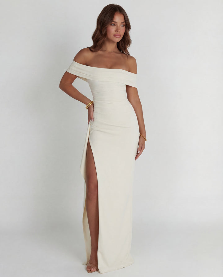 Figure-hugging off-shoulder maxi evening dress for women. Features elegant ruching & bodycon fit.