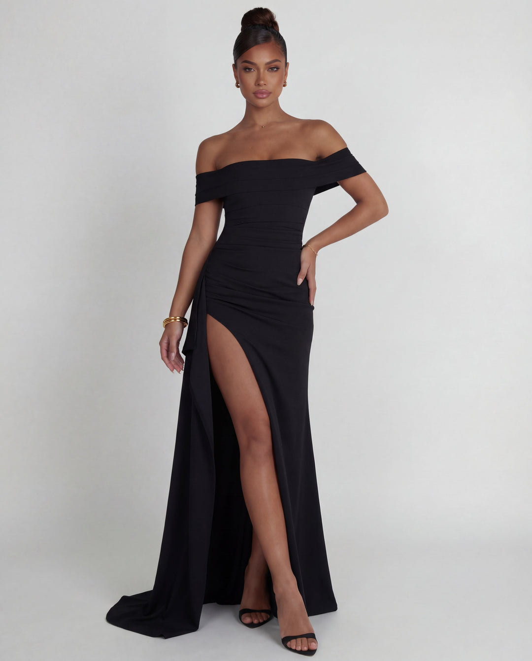 Women's formal off-shoulder long dress with ruched bodycon design. An elegant choice for evening wear.