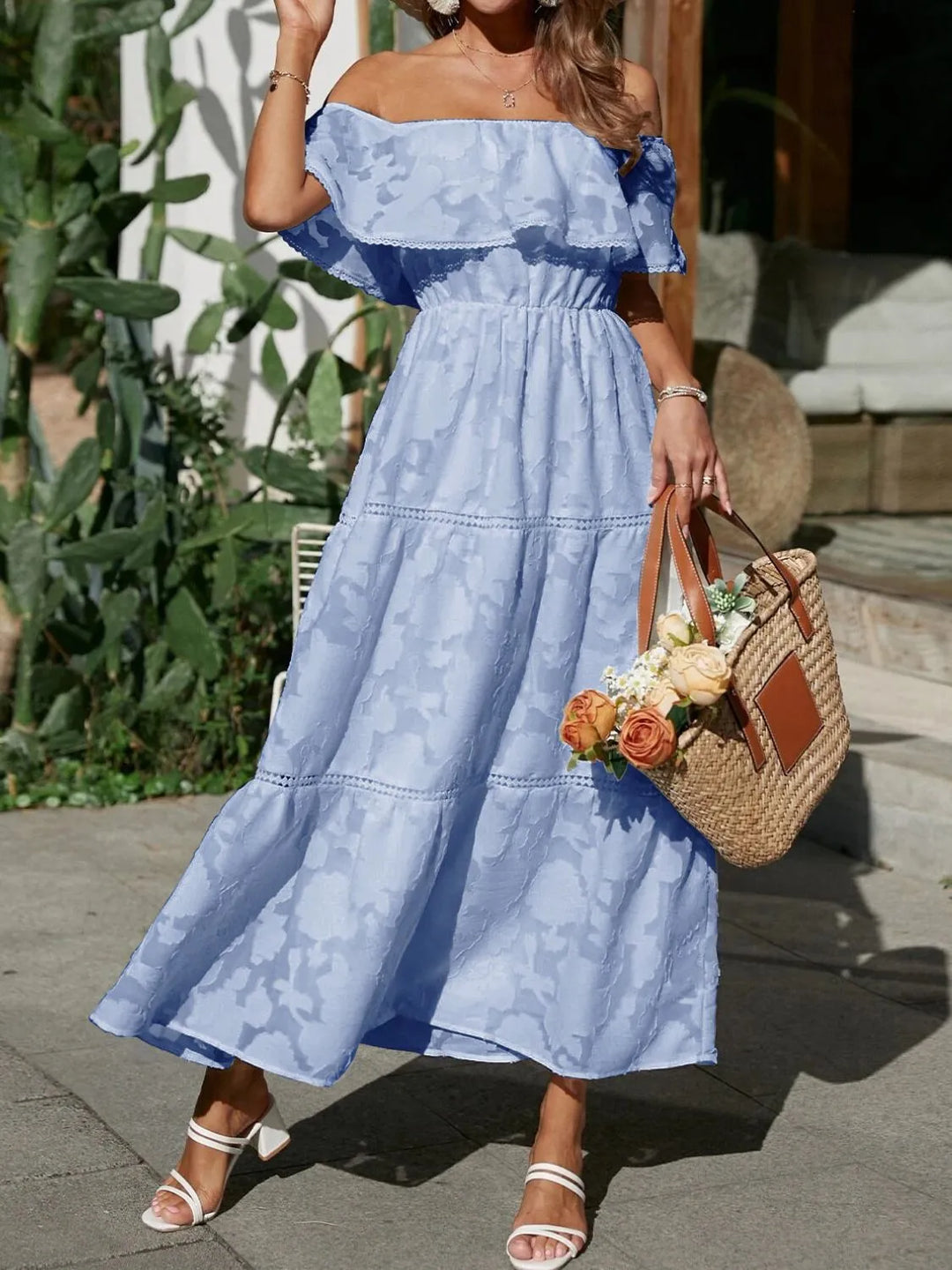 Summer-ready elegant off-shoulder ruffle maxi dress with flowing tiered skirt, great for parties.