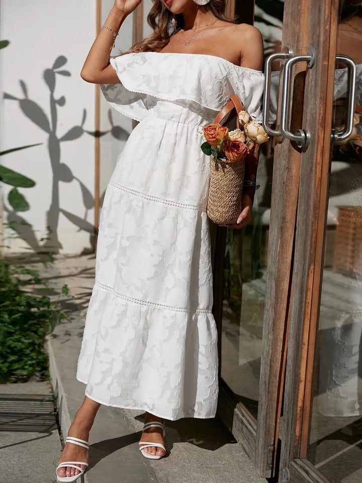 Flowing tiered skirt of an elegant off-shoulder ruffle maxi dress, perfect for special occasions.