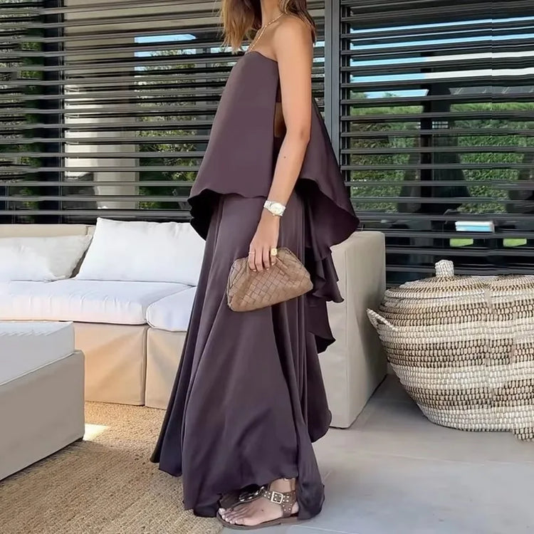 Fashionable women's off-shoulder top and maxi skirt matching set. Elegant two-piece summer casual chic outfit.